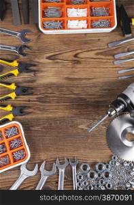 Set of different tools on wooden background