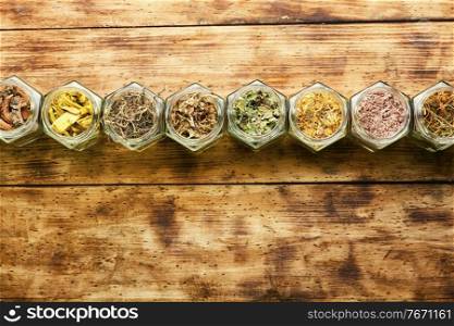 Set of dry medicinal herbs in glass jars.Alternative medicine concept or herbal medicine. Natural herbal medicine