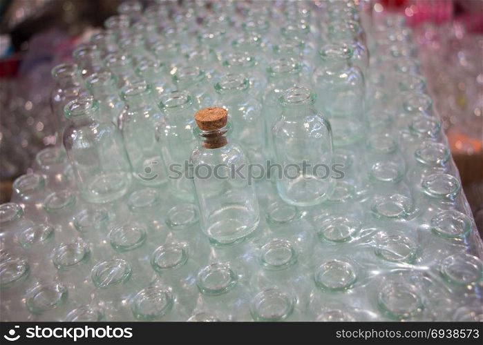 Set of Empty small transparent bottles in a box