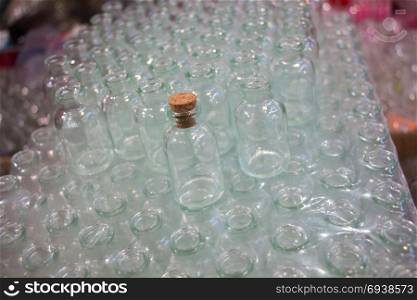 Set of Empty small transparent bottles in a box