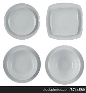 Set of empty white plates on white background.