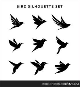 Set of flying birds sign logo vector. silhouettes isolated on white.