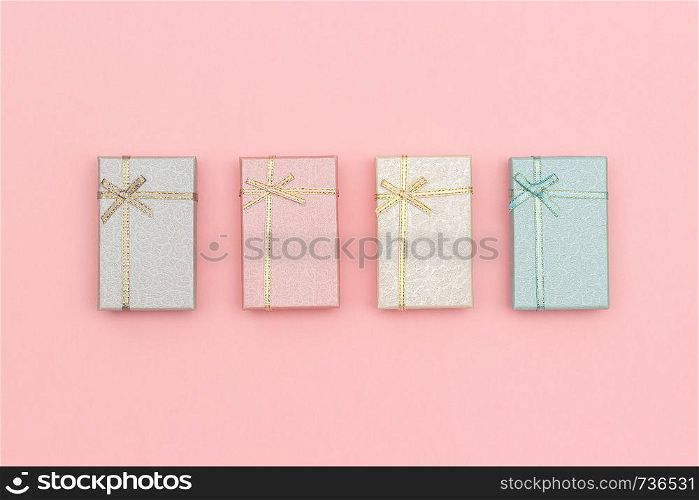 Set of gift boxes of pastel colors on pink background, Top view.. Set of gift boxes of pastel colors on pink background, Top view