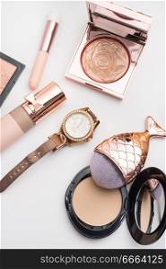 Set of luxury cosmetics for fashion make up  on white  background. pink gold