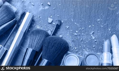 set of make up brushes with make up crumbles in classic blue color, web banner. make up brushes