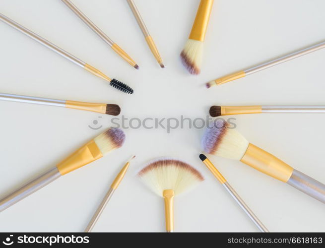 Set of make up silver and gold brushes on white background. Make up brushes