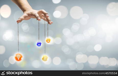 Set of media icons. Close up of human hand and items hanging on fingers