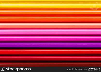 Set of multicolor pencils, abstract striped background. Multicolor striped background