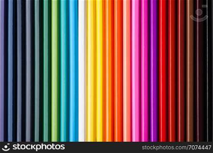Set of multicolor pencils, abstract striped background. Multicolor striped background
