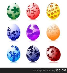 Set of nine Easter eggs in various colors with floral motives