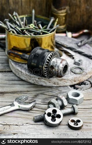 Set of nuts,bolts,springs and dies for threading