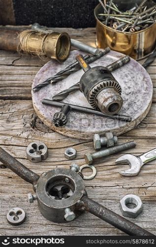 Set of old tools of the keys,screws and drills.