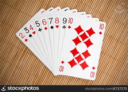 set of playing cards on bamboo background
