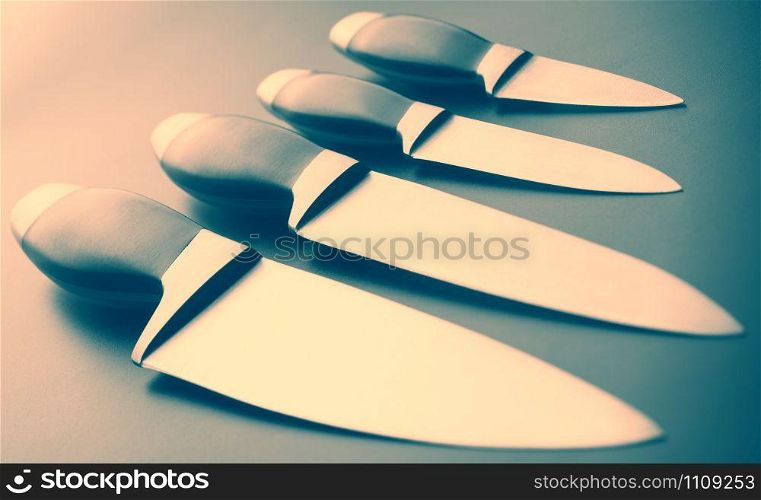 Set of professional kitchen knives. Toned