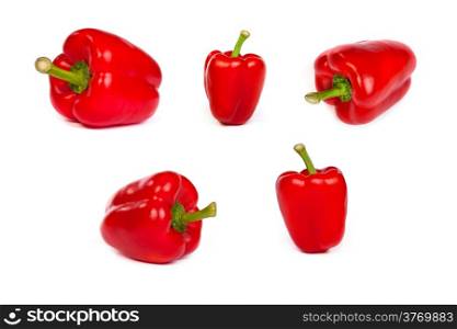 set of red bell sweet peppers isolated on plain white background.