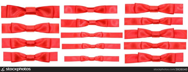 set of red bow knots on narrow satin ribbons isolated on white background