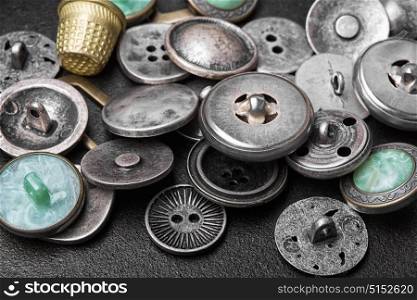 set of retro iron buttons. Large set of stylish old-fashioned metal buttons for clothes