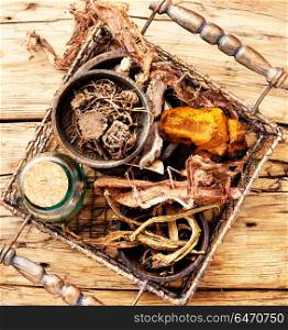 Set of roots of medicinal plants. Basket with roots and rhizomes for medicinal purposes