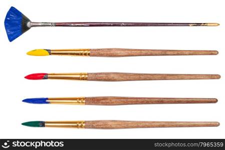 set of round artistic paintbrushes with painted tips isolated on white background