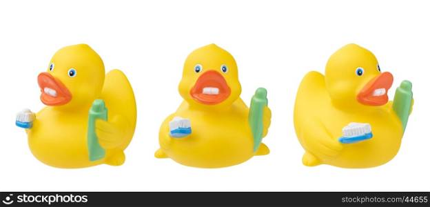 Set of rubber duck with toothpaste toothbrush. Isolated on white.