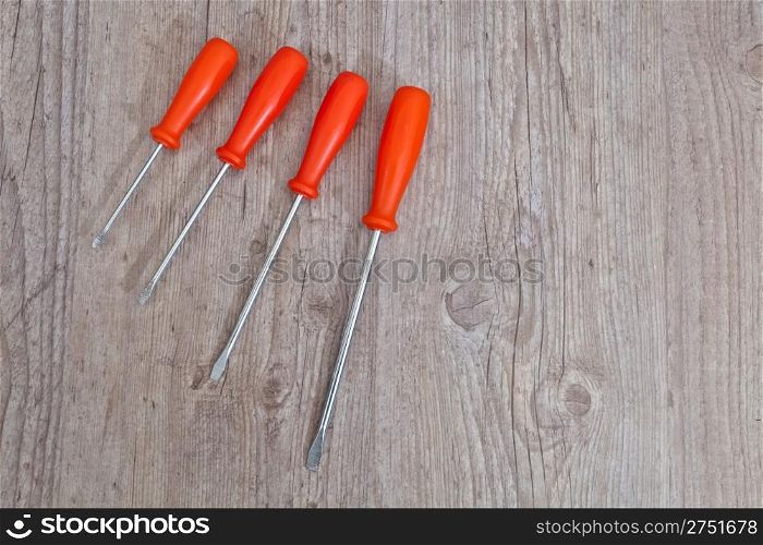 Set of screwdriver tools on wooden background