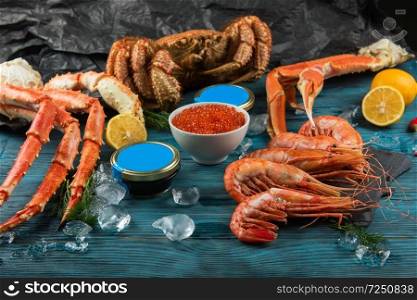 Set of seafood  red and black caviar, limb of hairy crab, limb of snow crab, far eastern kamchatka crab. Set of fresh seafood