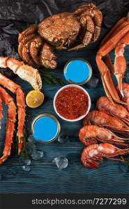 Set of seafood  red and black caviar, limb of hairy crab, limb of snow crab, far eastern kamchatka crab. Set of fresh seafood