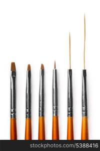 Set of six professional nail art brushes isolated on white