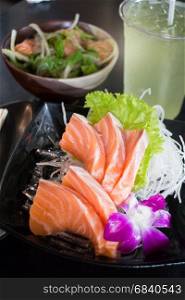 Set Of Sliced Salmon Sashimi And Green Tea, stock photo