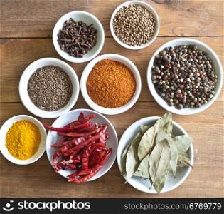 set of spices on wooden table