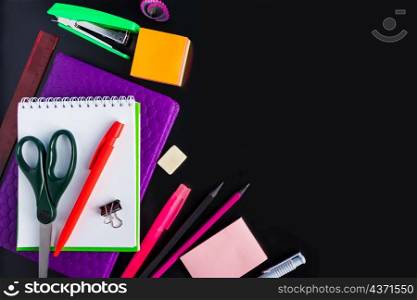 Set of stationery on a black background. Back to school concept. Place for text.. Set of stationery on black background. Back to school concept. Place for text.