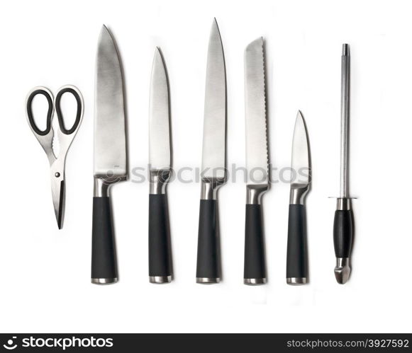 Set of steel kitchen knives, isolated on white with soft shadows. Includes carving, paring, and utility knives.