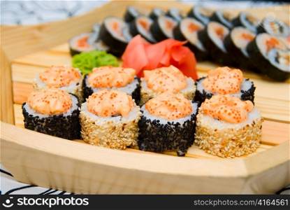 Set of sushi on wood plate