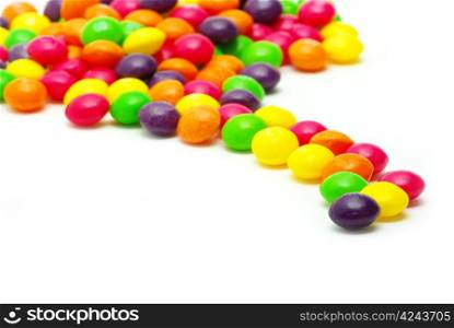 Set of sweet dragees of different color on white background
