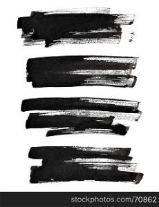 Set of textured black brush strokes isolated on the white background