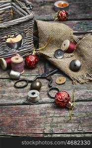 set of threads and buttons. Set of sewing tools on a wooden table and Christmas tree decorations