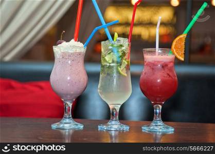 Set of three healthy nonalcoholic cocktails berries and classic mohito