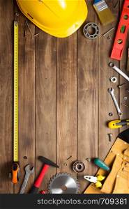 set of tools and instruments at wooden table surface background