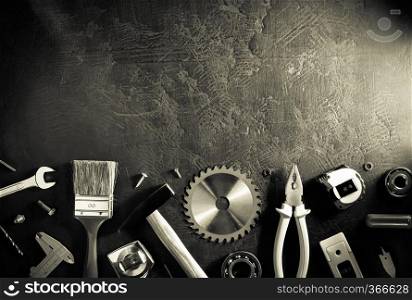 set of tools and instruments on black background