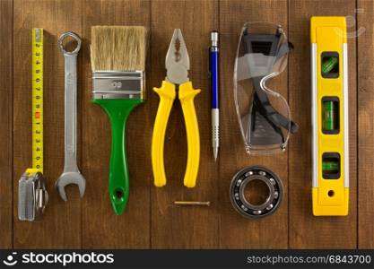 set of tools and instruments on wood. set of tools and instruments on wooden background