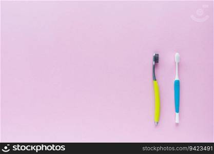 Set of toothbrush on pink background for dental care concept