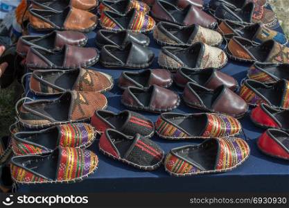 Set of traditional hand made leather shoes in a bazaar