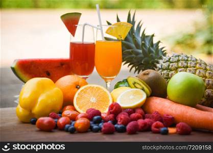 Set of tropical fruits colorful and fresh summer juice glass healthy foods / Many ripe fruit mixed on nature background