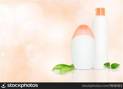 Set of two blank bottles for cometics on pink background with copyspace