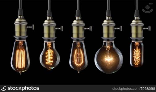 Set of vintage glowing light bulbs on black