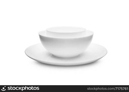 Set of white dishes on table on light background. With clippig path