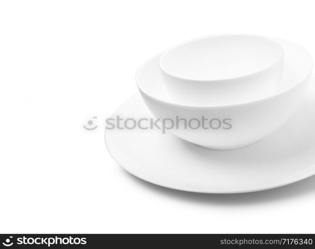 Set of white dishes on table on light background. With clippig path