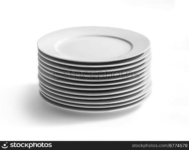 Set of white dishes on table on light background with clipping path