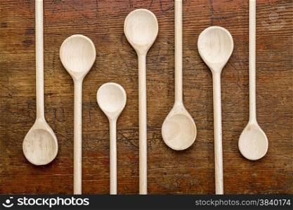 set of wooden spoons against grunge rustic wood