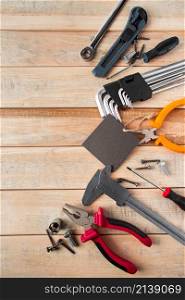 Set of work tools on a wooden background. Festive greeting card concept for Father&rsquo;s day. Set of work tools on a wooden background. Festive greeting card concept for Father&rsquo;s day.